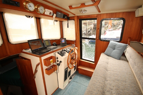 1999 Nordic Tug 32, Pilothouse Settee and Helm Area